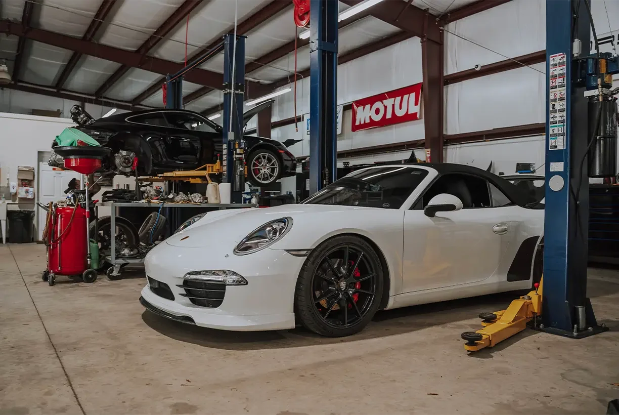 Porsche vehicles inside the HBi Auto service facility